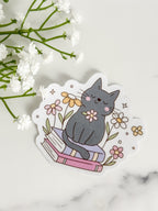 Cat Sitting On Books Sticker