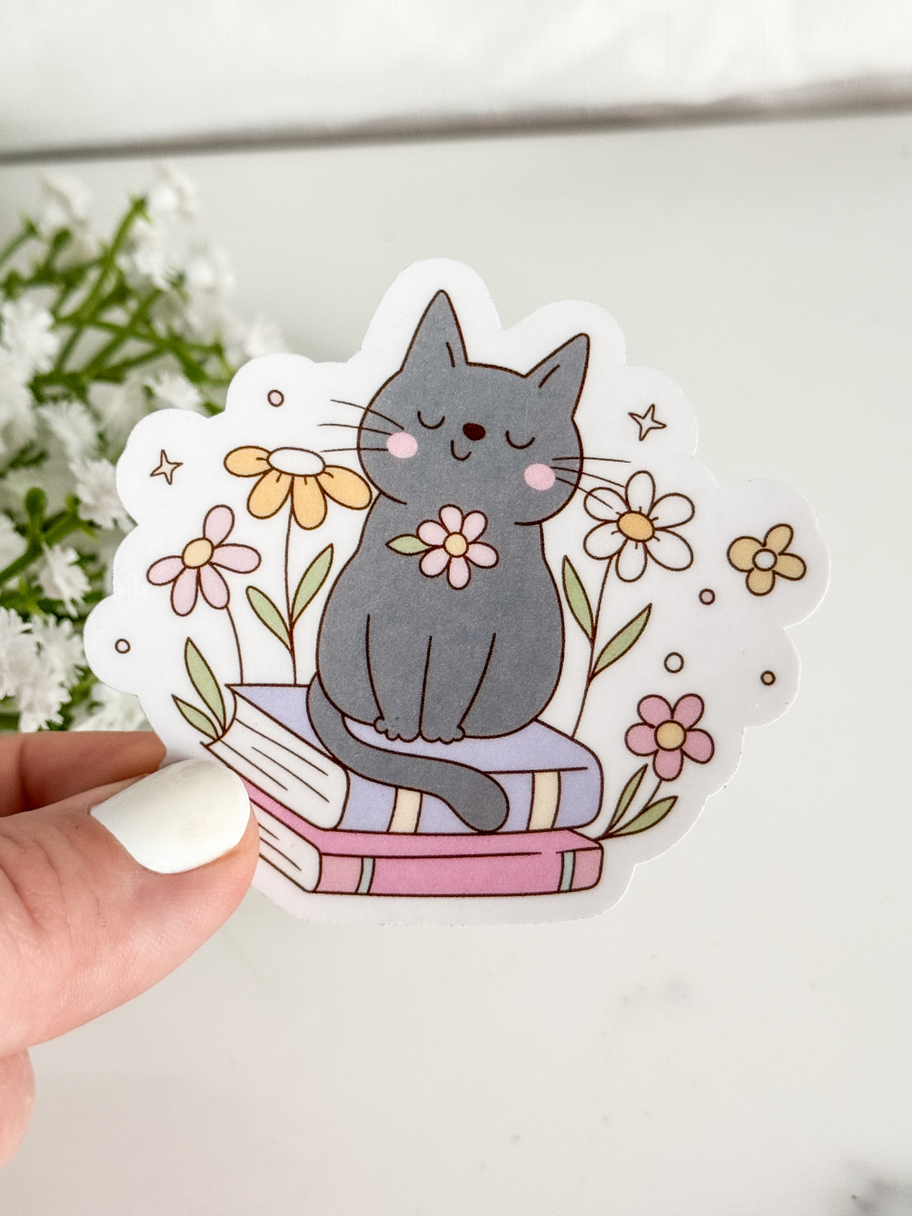 Cat Sitting On Books Sticker