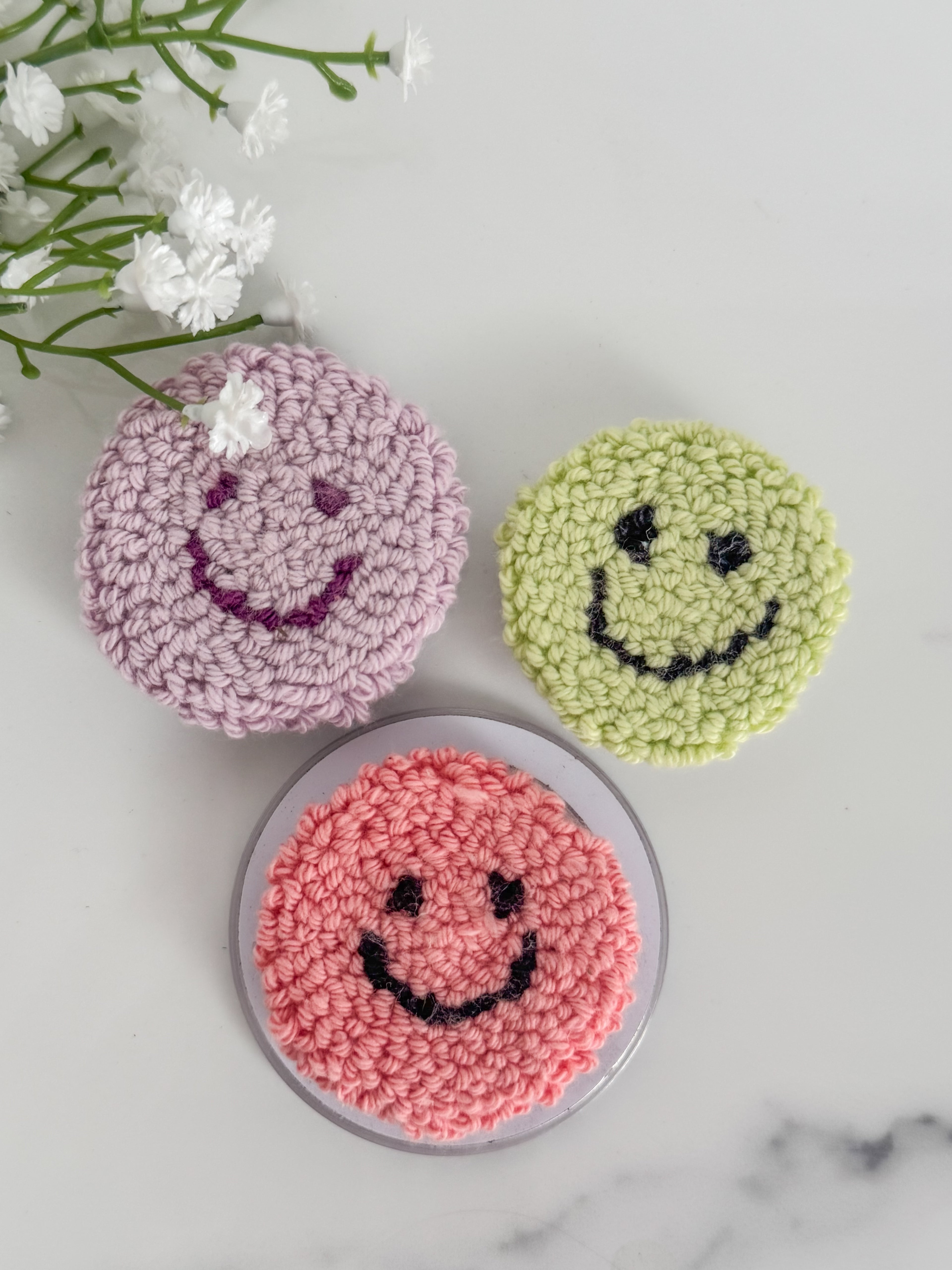 Smiley Face Punch Needle Phone Grip
