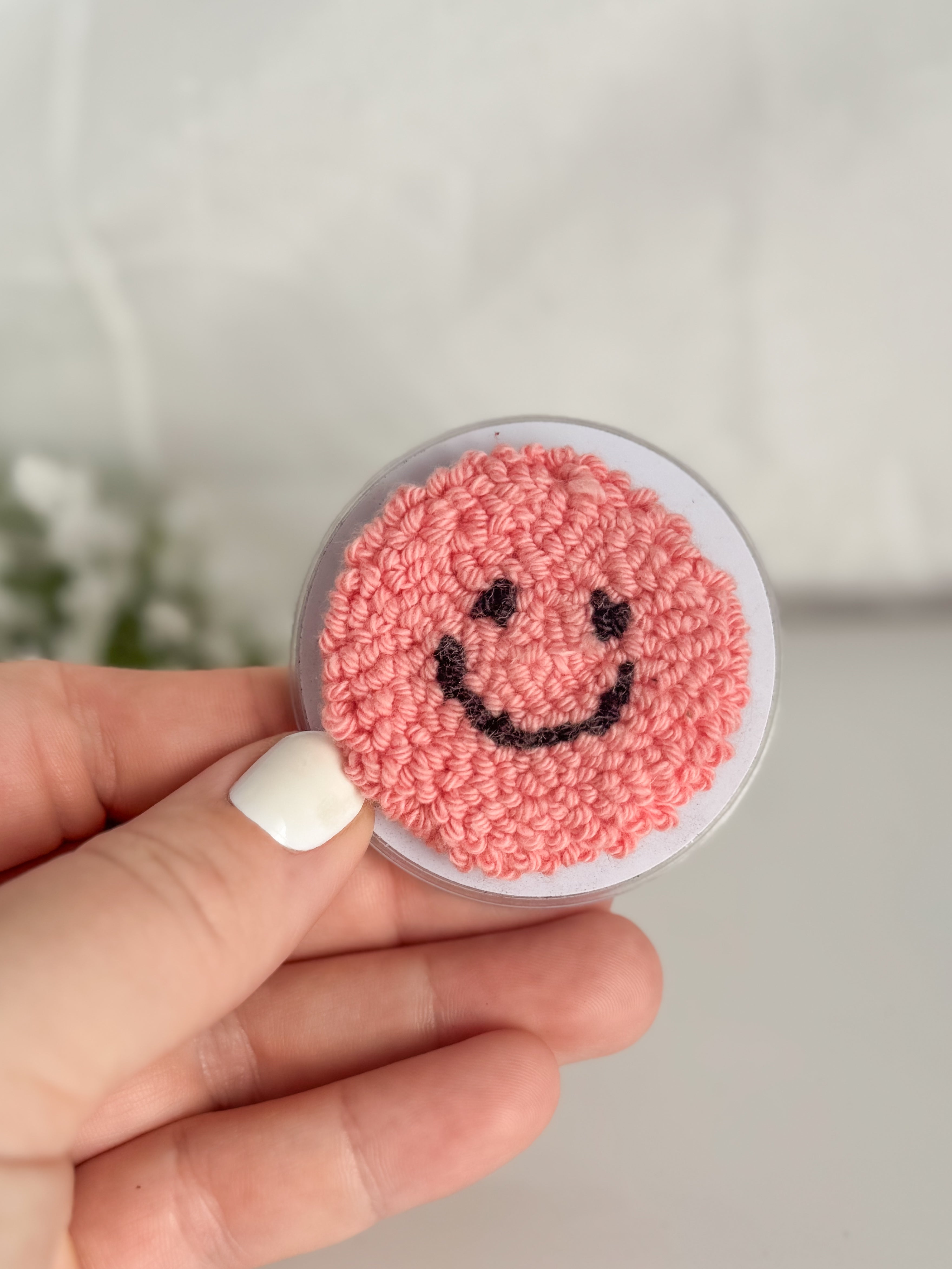 Smiley Face Punch Needle Phone Grip
