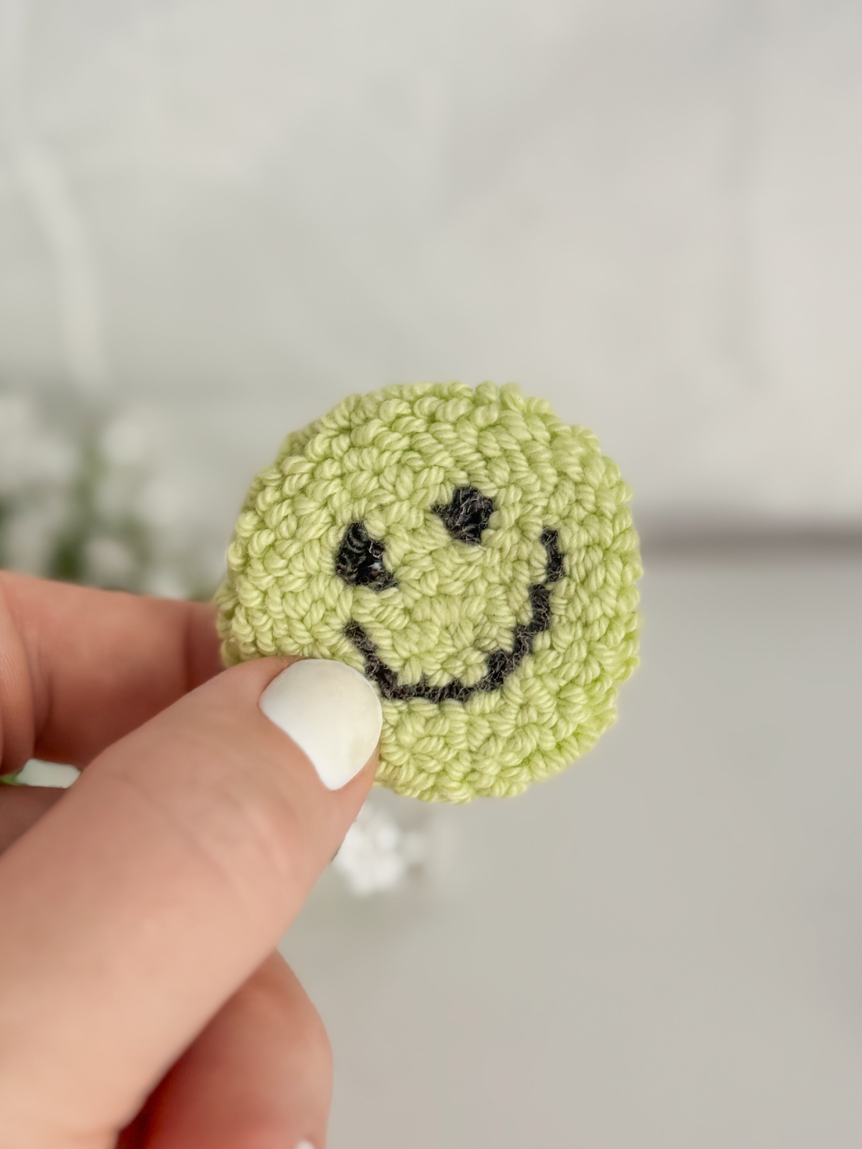 Smiley Face Punch Needle Phone Grip