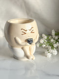 Sitting On Toilet Pot